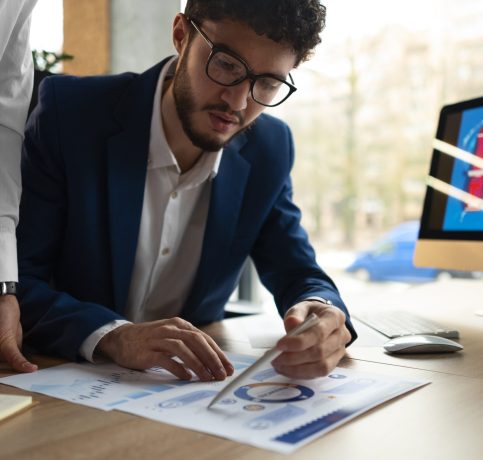 people-analyzing-checking-finance-graphs-office