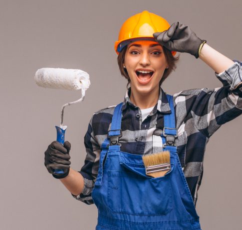 Portrait of repairer woman with painting roller isolated